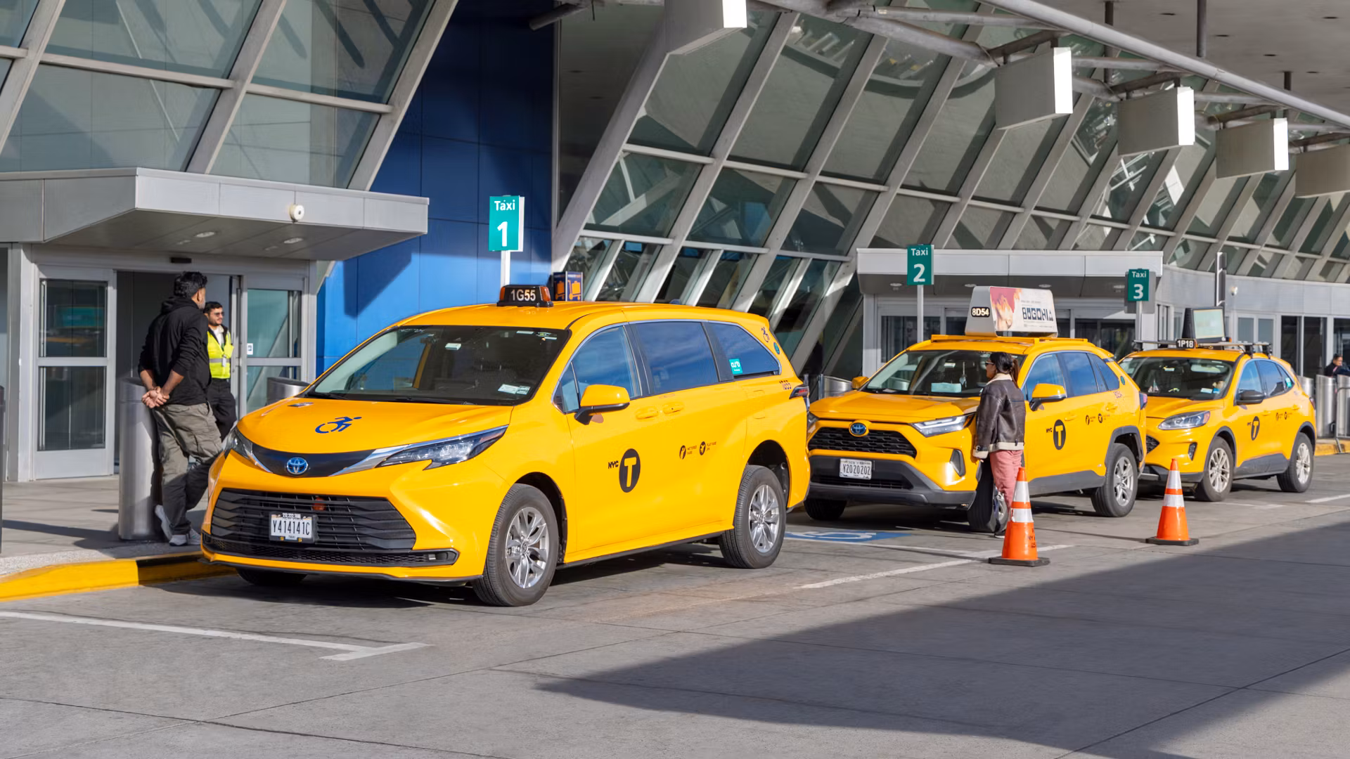 Airport taxi waiting at the curb